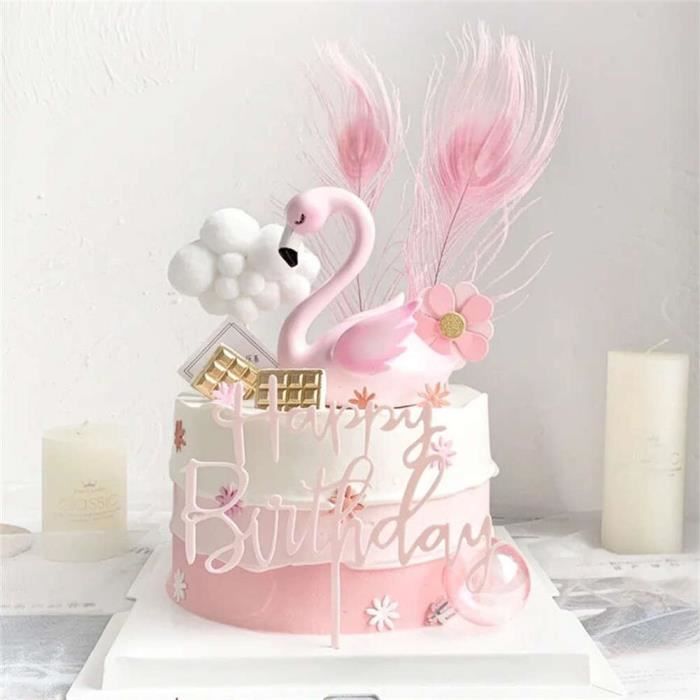 Un Gâteau D'anniversaire Avec Une Figure De Flamant Rose