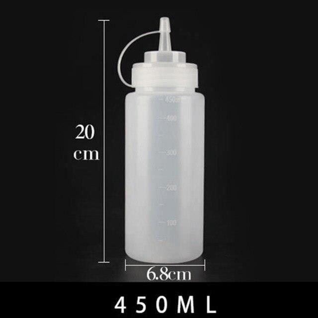 Une Collection De Bouteilles D'huile De Cuisson Logées Dans Une Boîte