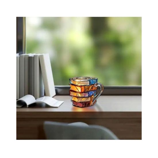Une pile de livres avec une tasse de café et un livre sur le dessus