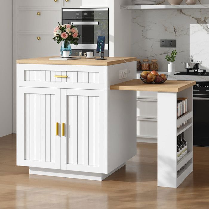 Table de bar extensible îlot de cuisine blanc avec prises électriques intégrées façades à rainures verticales tiroir et étagère