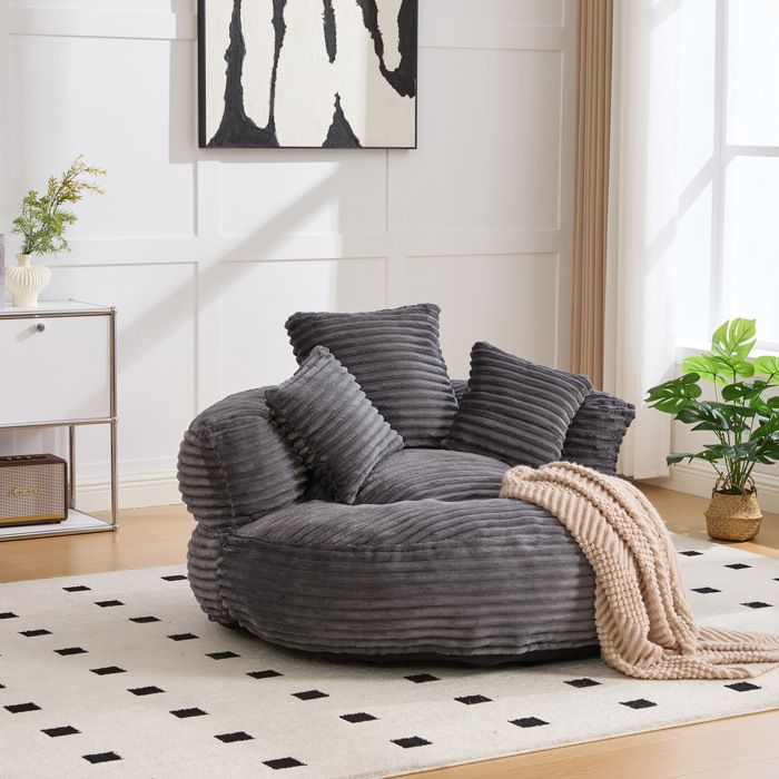 Fauteuil lounge en velours côtelé gris foncé avec dossier haut et accoudoirs
